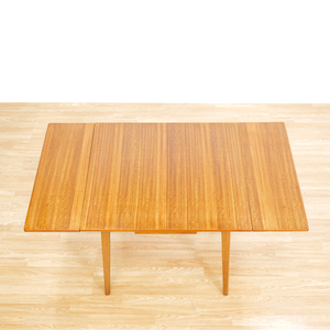 MID CENTURY EXTENDING DINING TABLE AND FOUR CHAIRS BY E GOMME