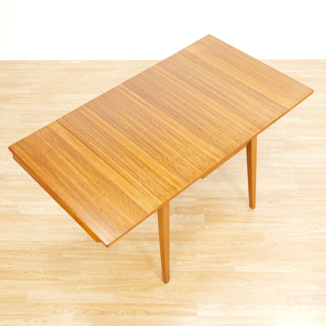 MID CENTURY EXTENDING DINING TABLE AND FOUR CHAIRS BY E GOMME