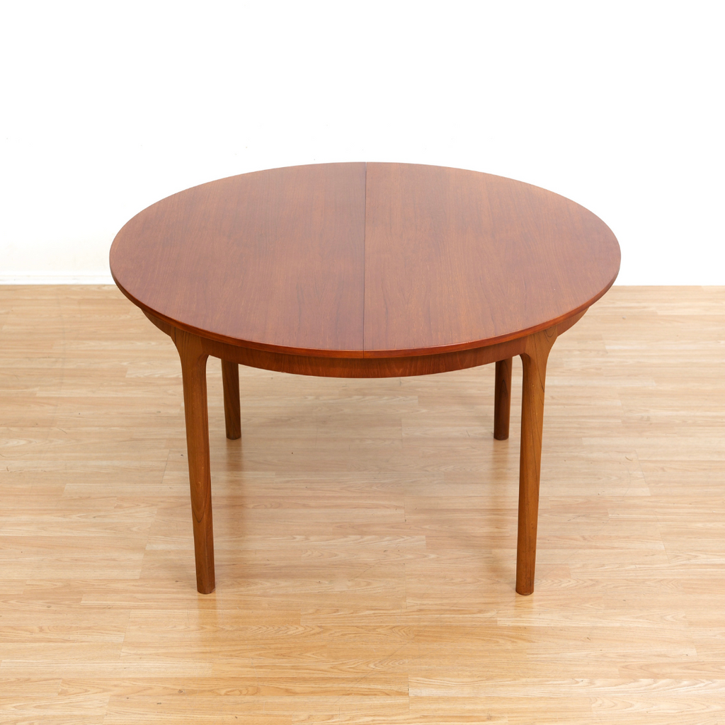 MID CENTURY ROUND TEAK EXTENDING DINING TABLE BY TOM ROBERTSON FOR MCINTOSH OF KIRKCALDY