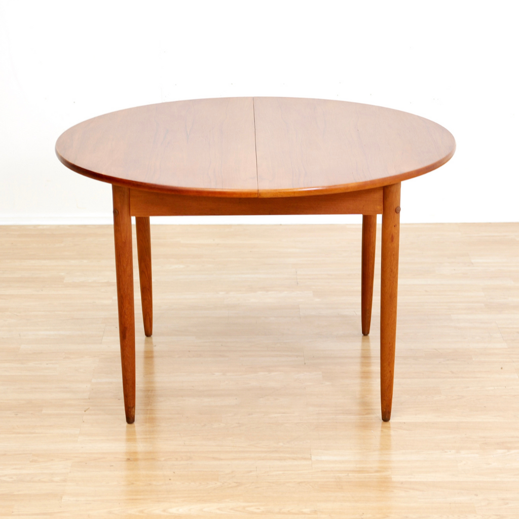MID CENTURY ROUND TEAK EXTENDING DINING TABLE