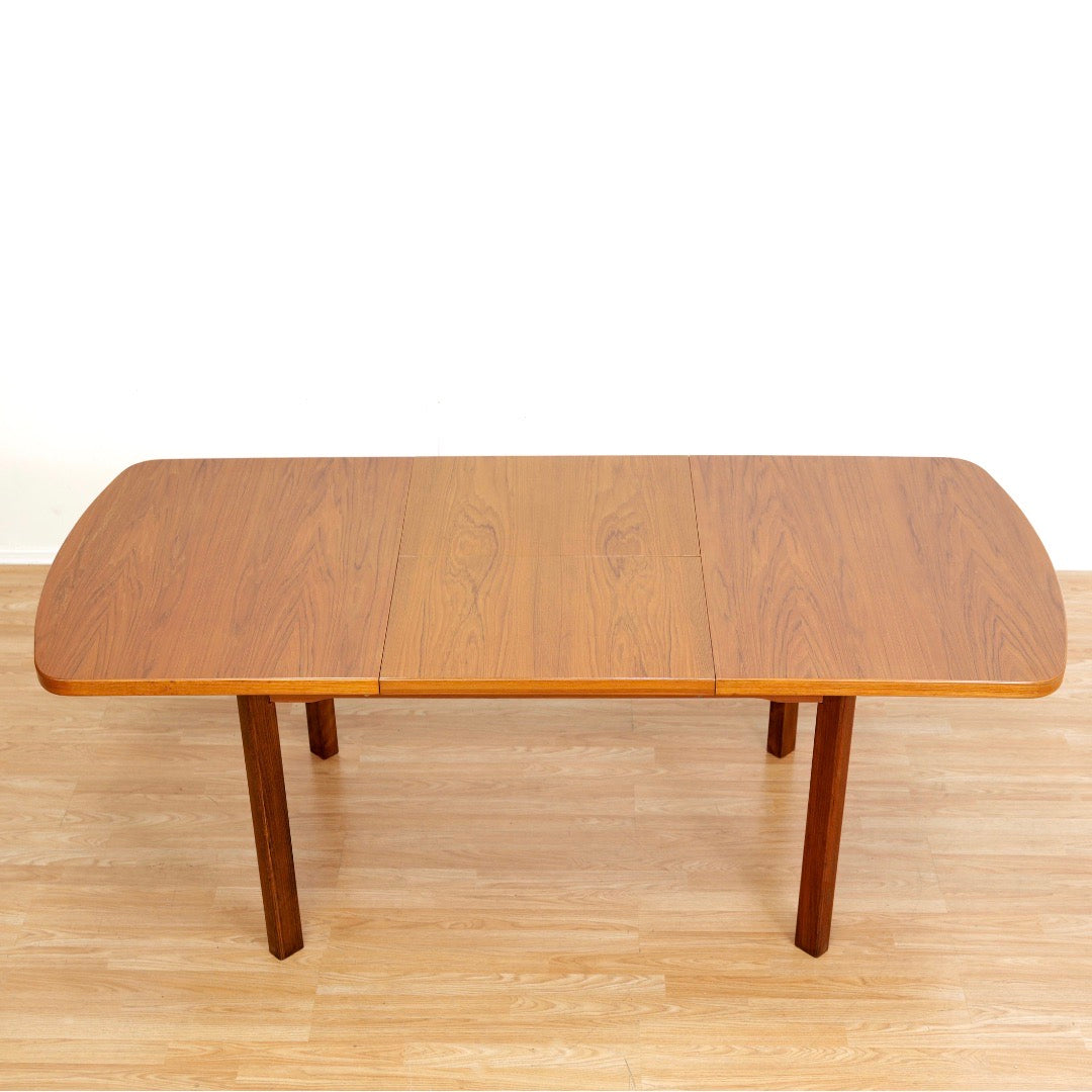 1970S TEAK EXTENDING DINING TABLE MADE IN GERMANY