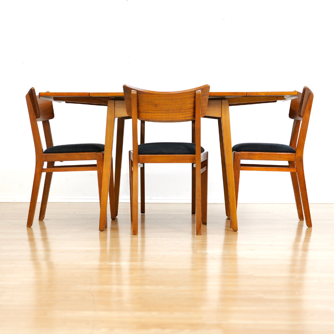 MID CENTURY EXTENDING DINING TABLE AND FOUR CHAIRS BY E GOMME