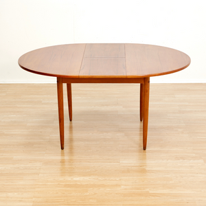 MID CENTURY ROUND TEAK EXTENDING DINING TABLE