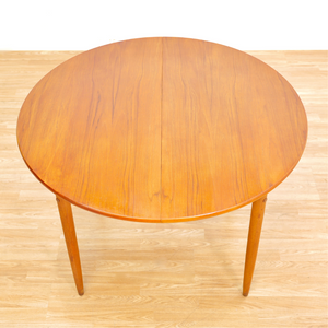 MID CENTURY ROUND TEAK EXTENDING DINING TABLE