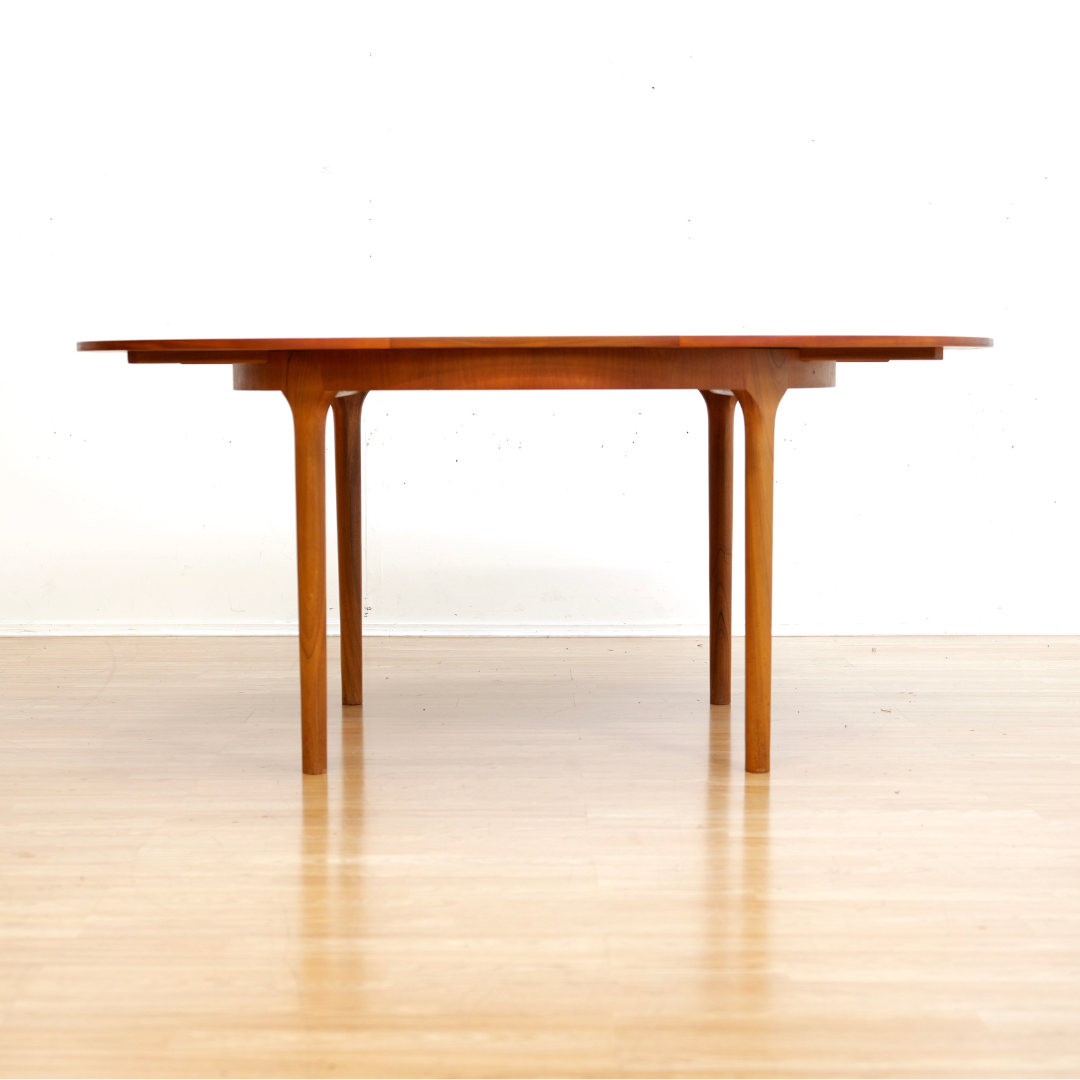 MID CENTURY ROUND TEAK EXTENDING DINING TABLE BY TOM ROBERTSON FOR MCINTOSH OF KIRKCALDY