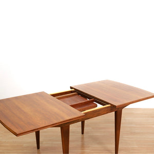 MID CENTURY ENGLISH WALNUT EXTENDING DINING TABLE BY ALFRED COX