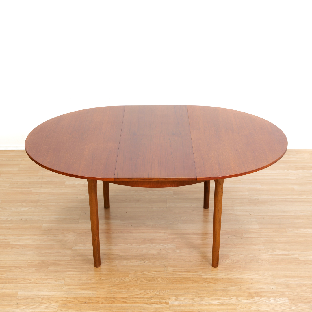 MID CENTURY ROUND TEAK EXTENDING DINING TABLE BY TOM ROBERTSON FOR MCINTOSH OF KIRKCALDY