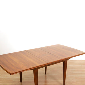 MID CENTURY ENGLISH WALNUT EXTENDING DINING TABLE BY ALFRED COX