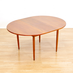MID CENTURY ROUND TEAK EXTENDING DINING TABLE