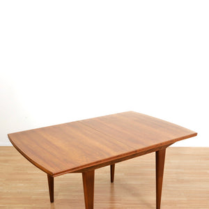 MID CENTURY ENGLISH WALNUT EXTENDING DINING TABLE BY ALFRED COX