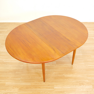 MID CENTURY ROUND TEAK EXTENDING DINING TABLE