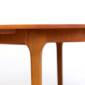 MID CENTURY ROUND TEAK EXTENDING DINING TABLE BY TOM ROBERTSON FOR MCINTOSH OF KIRKCALDY