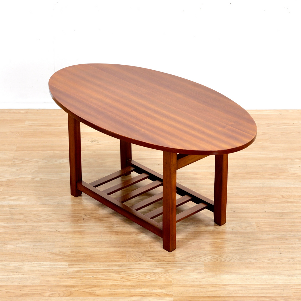 MID CENTURY OVAL SIDE TABLE IN MAHOGANY