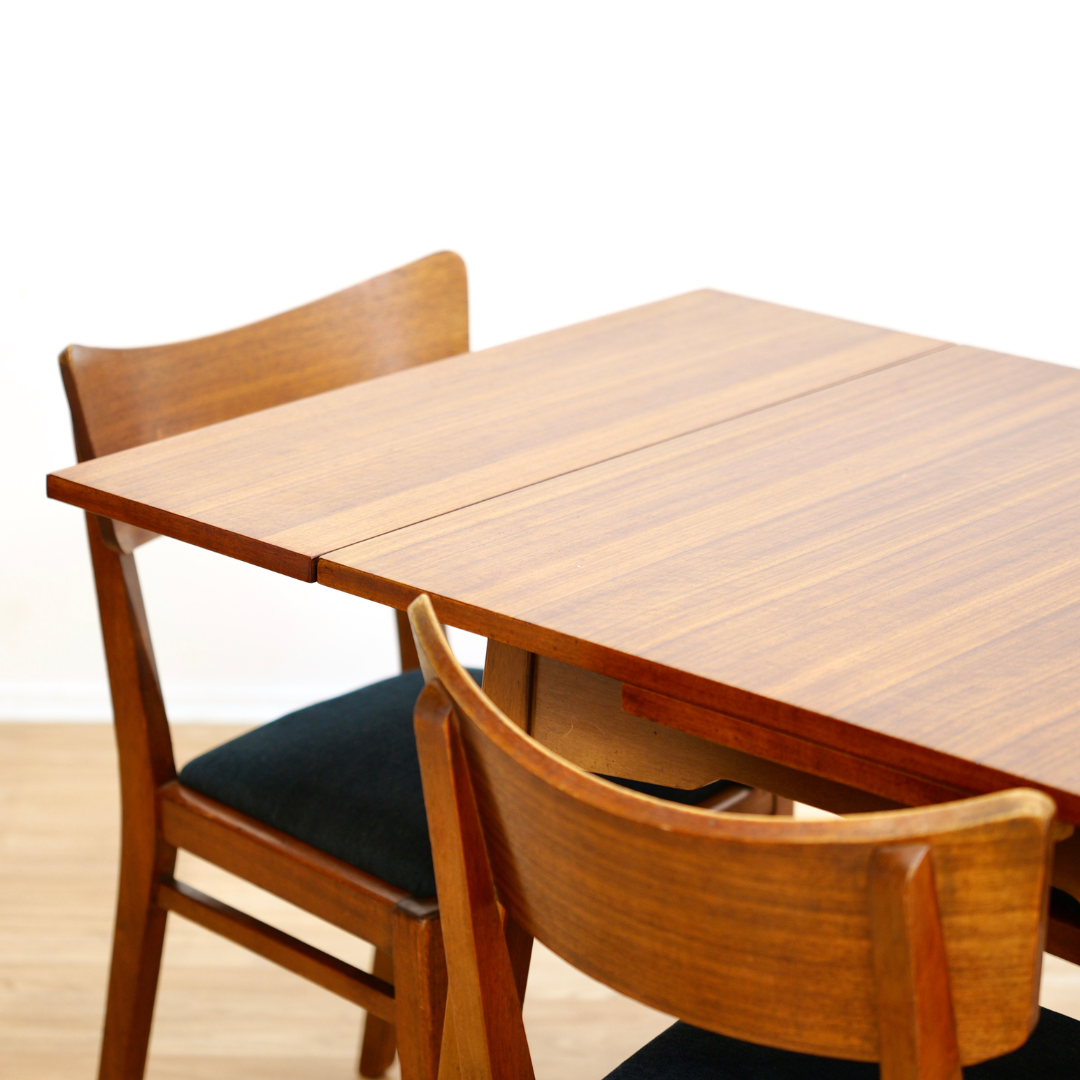 MID CENTURY EXTENDING DINING TABLE AND FOUR CHAIRS BY E GOMME