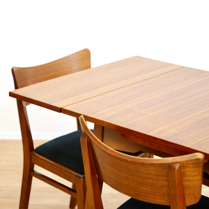 MID CENTURY EXTENDING DINING TABLE AND FOUR CHAIRS BY E GOMME