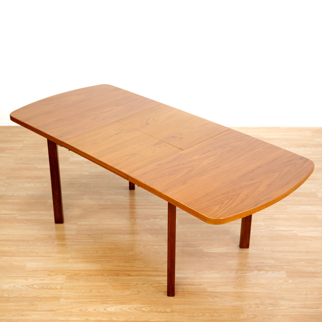 1970S TEAK EXTENDING DINING TABLE MADE IN GERMANY