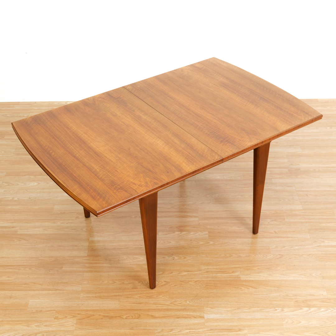 MID CENTURY ENGLISH WALNUT EXTENDING DINING TABLE BY ALFRED COX