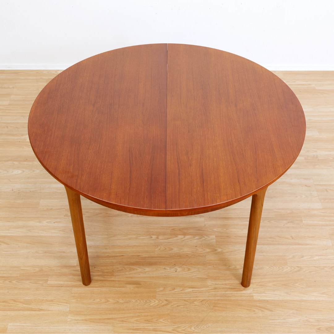 MID CENTURY ROUND TEAK EXTENDING DINING TABLE BY TOM ROBERTSON FOR MCINTOSH OF KIRKCALDY