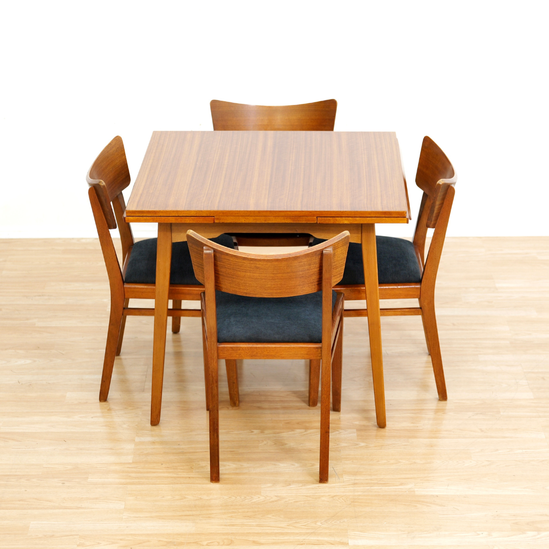 MID CENTURY EXTENDING DINING TABLE AND FOUR CHAIRS BY E GOMME