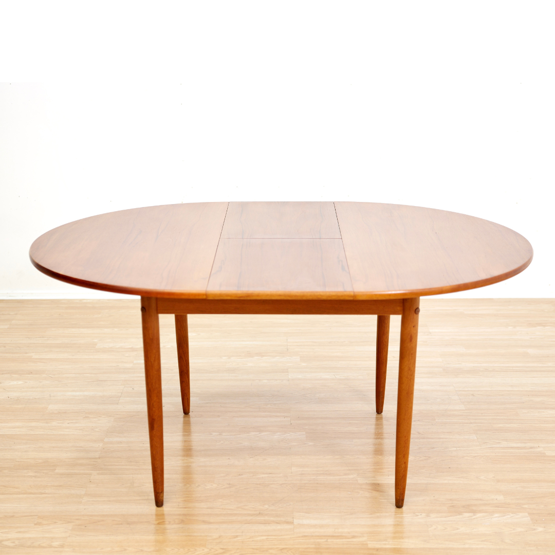 MID CENTURY ROUND TEAK EXTENDING DINING TABLE
