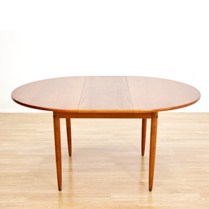 MID CENTURY ROUND TEAK EXTENDING DINING TABLE