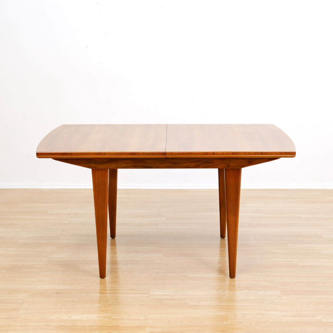MID CENTURY ENGLISH WALNUT EXTENDING DINING TABLE BY ALFRED COX