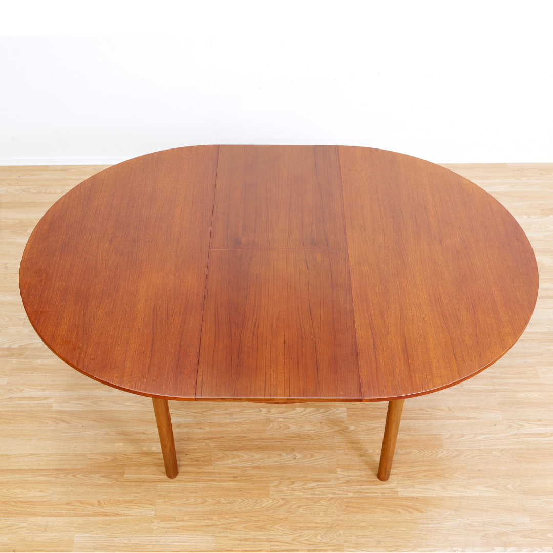 MID CENTURY ROUND TEAK EXTENDING DINING TABLE BY TOM ROBERTSON FOR MCINTOSH OF KIRKCALDY