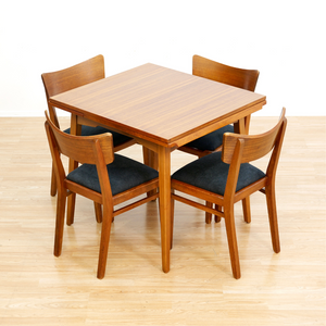 MID CENTURY EXTENDING DINING TABLE AND FOUR CHAIRS BY E GOMME