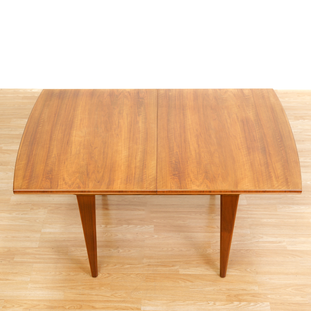 MID CENTURY ENGLISH WALNUT EXTENDING DINING TABLE BY ALFRED COX