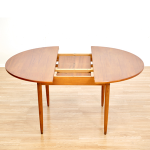 MID CENTURY ROUND TEAK EXTENDING DINING TABLE